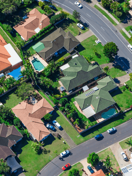 Home 4 Aerial view of Geelong suburb with houses, pools and tree-lined streets